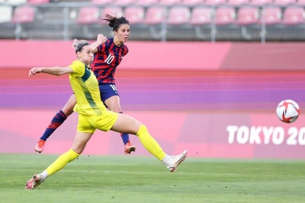 Carli Lloyd of Team United States scores their side's third goal whilst under pressure from Alanna Kennedy of Team Australia during the Women's...