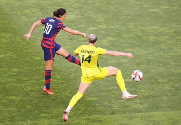 Carli Lloyd of Team United States scores their side's third goal whilst under pressure from Alanna Kennedy of Team Australia during the Women's...