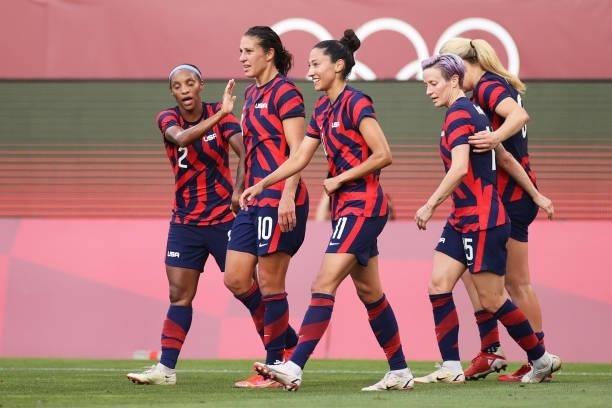 Carli Lloyd of Team United States celebrates with Christen Press, Megan Rapinoe and teammates after scoring their side's third goal during the...
