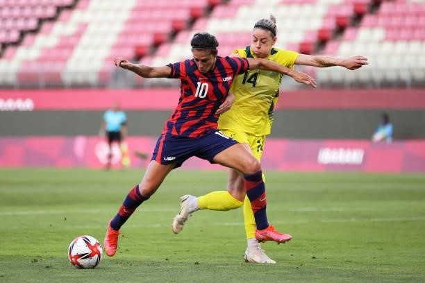 Carli Lloyd of Team United States holds off Alanna Kennedy of Team Australia during the Women's Bronze Medal match between United States and...