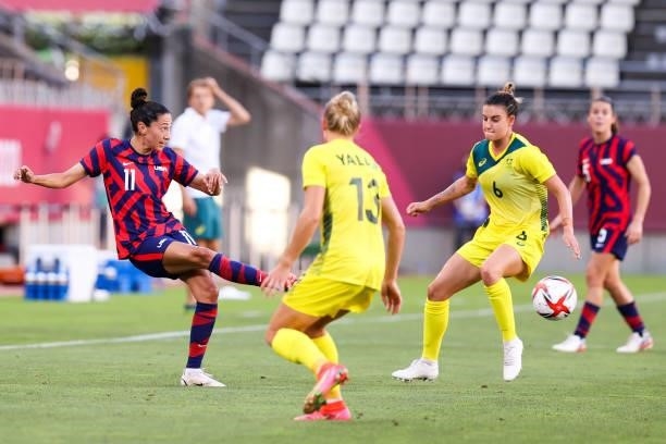Christen Press of United States pass the ball during the Olympic football bronze medal match between United States and Australia at Kashima Stadium...