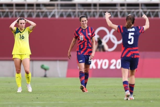 Carli Lloyd of Team United States celebrates after scoring their side's third goal as Hayley Raso of Team Australia looks dejected during the Women's...