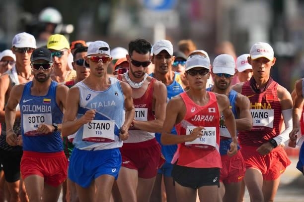 Manuel Esteban Soto of Colombia, Massimo Stano of Italy, Toshikazu Yamanishi of Japan and Wang Kaihua of China compete in the Men's 20km Race Walk...