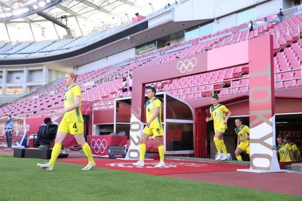 Clare Polkinghorne, Chloe Logarzo and Steph Catley of Team Australia take to the field prior to the Women's Bronze Medal match between United States...