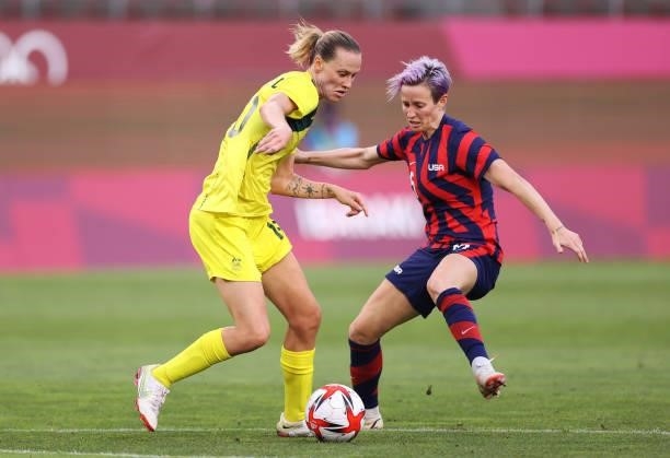 Emily Van Egmond of Team Australia is closed down by Megan Rapinoe of Team United States during the Women's Bronze Medal match between United States...