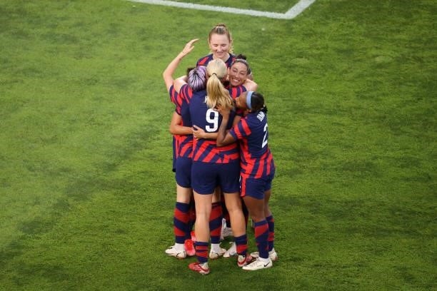 Carli Lloyd of Team United States celebrates with team mates after scoring their side's fourth goal during the Women's Bronze Medal match between...