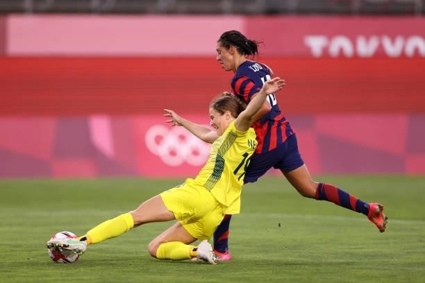 Courtney Nevin of Team Australia is closed down by Carli Lloyd of Team United States during the Women's Bronze Medal match between United States and...