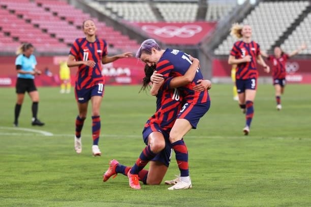 Carli Lloyd of Team United States celebrates with teammate Megan Rapinoe after scoring their side's fourth goal during the Women's Bronze Medal match...