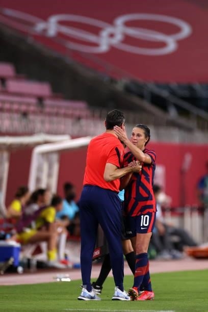 Carli Lloyd of Team United States is congratulated by Vlatko Andonovski, Head Coach of Team United States after being substituted during the Women's...