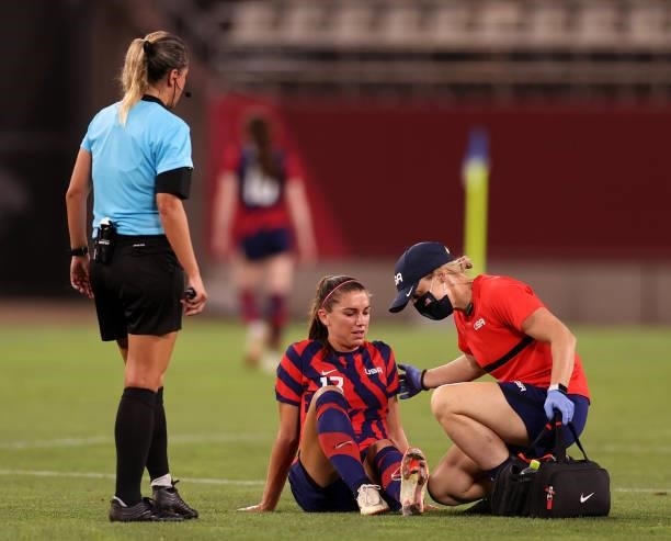 Alex Morgan of Team United States receives medical treatment during the Women's Bronze Medal match between United States and Australia on day...
