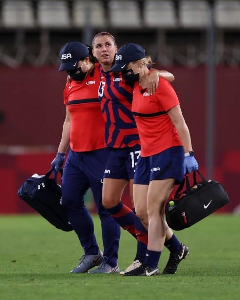Alex Morgan of Team United States reacts leaves the pitch after picking up an injury during the Women's Bronze Medal match between United States and...