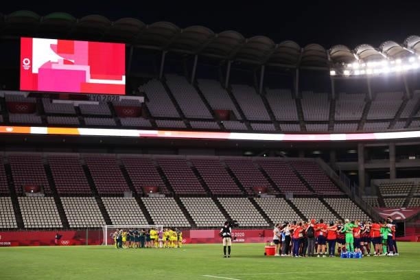 Both teams form huddle's following the Women's Bronze Medal match between United States and Australia on day thirteen of the Tokyo 2020 Olympic Games...