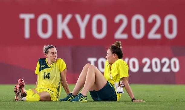 Alanna Kennedy of Team Australia looks dejected as she is consoled by a team mate following defeat in the Women's Bronze Medal match between United...