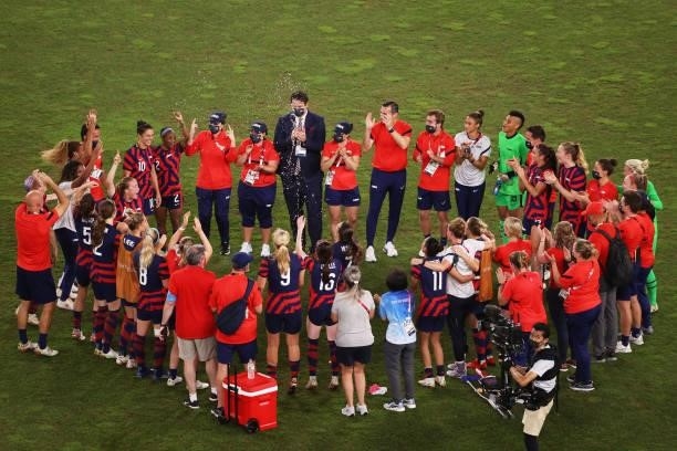 Players of Team United States celebrate their side's victory after the Women's Bronze Medal match between United States and Australia on day thirteen...