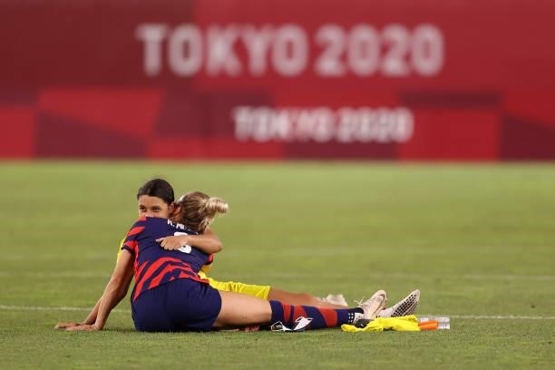 Kristie Mewis of Team United States hugs Sam Kerr of Team Australia following the Women's Bronze Medal match between United States and Australia on...