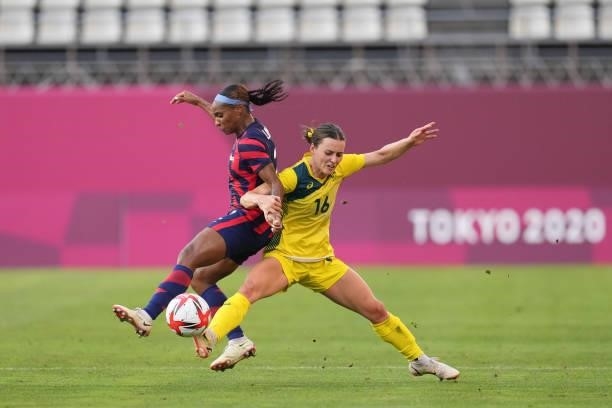 Crystal Dunn of the United States battles for the ball with Hayley Raso of Australia during a game between Australia and USWNT at Kashima Soccer...