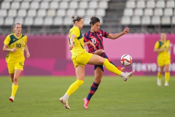 Alanna Kennedy of Australia battles for the ball with Carli Lloyd of the United States during a game between Australia and USWNT at Kashima Soccer...