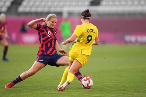 Lindsey Horan of the United States battles for the ball with Caitlin Foord of Australia during a game between Australia and USWNT at Kashima Soccer...