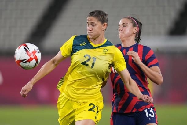 Laura Brock of Australia battles for the ball with Alex Morgan of the United States during a game between Australia and USWNT at Kashima Soccer...
