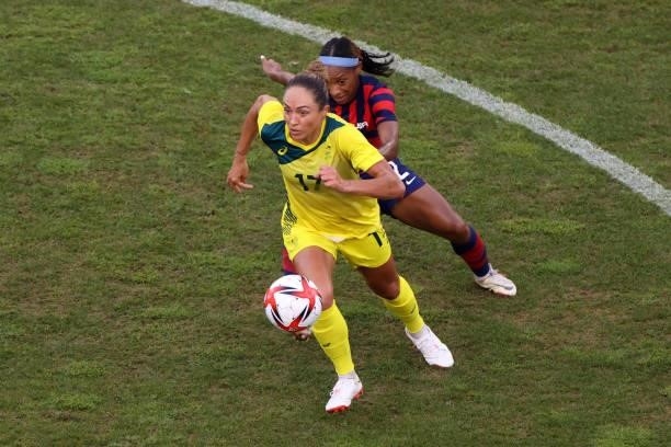 Kyah Simon of Team Australia battles for possession with Crystal Dunn of Team United States during the Women's Bronze Medal match between United...