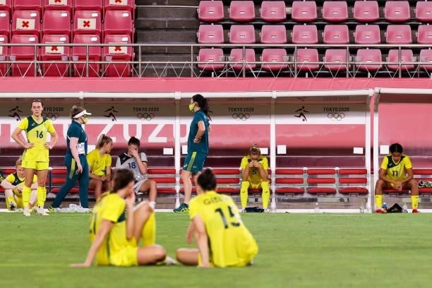 Players of Australia show their dejection after the Olympic football bronze medal match between United States and Australia at Kashima Stadium on...