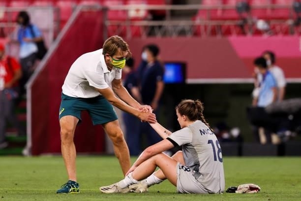 Gustavsson Tony head coach of Australia shakes hand with Teagan Micah of Australia after the Olympic football bronze medal match between United...