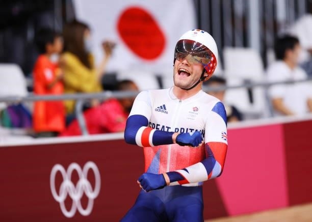Matthew Walls of Team Great Britain celebrates winning a gold medal during the Men's Omnium points race, 4 round of 4 of the track cycling on day...