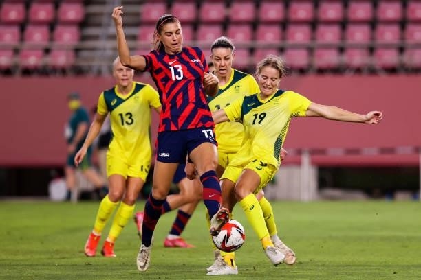 Alex Morgan of Team United States competes for the ball with Courtney Nevin of Team Australia during the Olympic football bronze medal match between...
