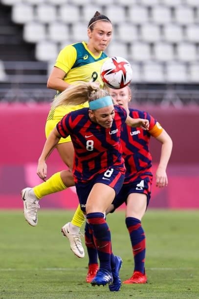 Julie Ertz of Team United States competes for the ball with Lindsey Horan of Team Australia during the Olympic football bronze medal match between...
