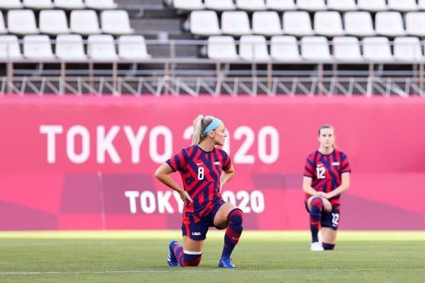 Julie Ertz of Team United States kneels on the field during the Olympic football bronze medal match between United States and Australia at Kashima...