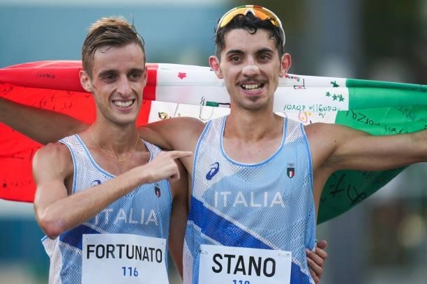 Massimo Stano of Team Italy celebrates with Francesco Fortunato of Team Italy after winning the Men's 20km Race Walk on day thirteen of the Tokyo...
