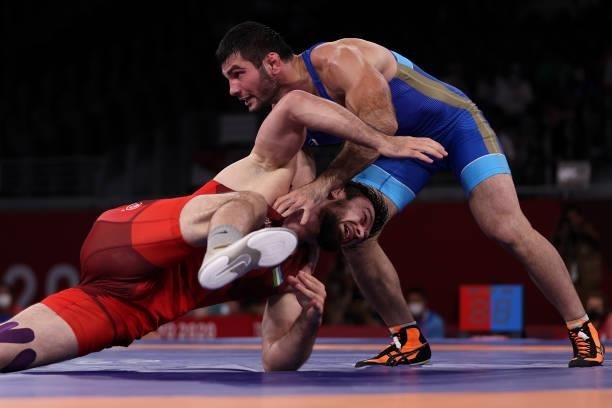 Artur Naifonov of Team ROC competes against Javrail Shapiev of Team Uzbekistan during the Men's Freestyle 86kg Bronze Medal Match on day thirteen of...