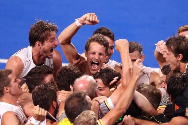 Team Belgium celebrate victory in the Men's Gold Medal match between Australia and Belgium on day thirteen of the Tokyo 2020 Olympic Games at Oi...