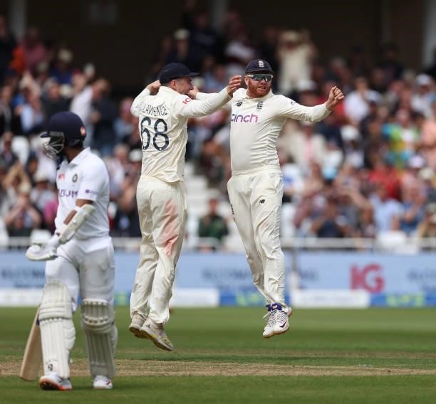 Jonny Bairstow of England celebrates with Dan Lawrence after running out Ajinkya Rahane of India during day two of the First LV= Insurance test match...
