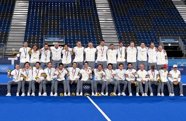 The Belgian players poses for a photo as they celebrate victory after the gold medal final match between Australia and Belgium on day thirteen of the...