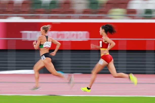 Zheng Ninali of Team China and Ekaterina Voronina of Team Uzbekistan compete in the Women's Heptathlon 800m heats on day thirteen of the Tokyo 2020...