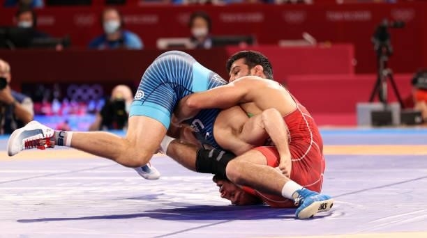 David Morris Taylor III of Team United States competes against Hassan Yazdanicharati of Team Iran during the Men's Freestyle 86kg Final on day...