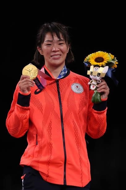Women's Freestyle 57kg gold medalist Risako Kawai of Team Japan poses with her medal on day thirteen of the Tokyo 2020 Olympic Games at Makuhari...
