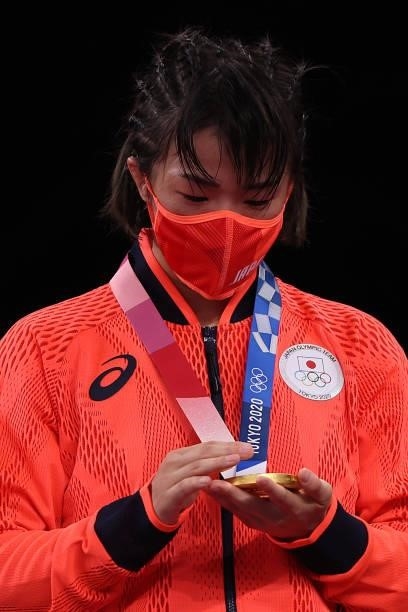 Women's Freestyle 57kg gold medalist Risako Kawai of Team Japan poses with her medal on day thirteen of the Tokyo 2020 Olympic Games at Makuhari...