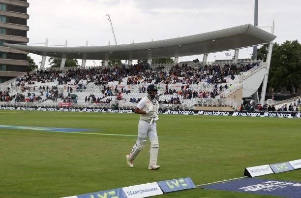 Kannaur Rahul of India runs off the pitch as rain stops play during day two of the First LV= Insurance test match between England and India at Trent...