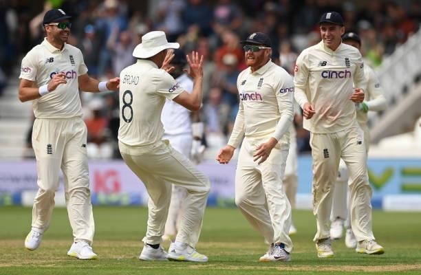 Jonny Bairstow and Stuart Broad of England celebrate after the run out of Ajinkya Rahane of India during the 1st LV= Test match between England and...