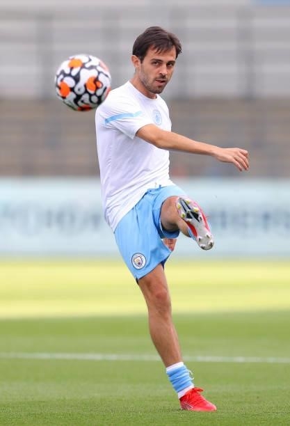 Bernardo Silva of Manchester City passes the ball during the warm up prior to a pre-season match between Manchester City and Blackpool at Manchester...