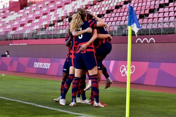 Megan Rapinoe of the United States celebrates with her team mates after scoring her sides first goal during the Tokyo 2020 Olympic Womens Football...