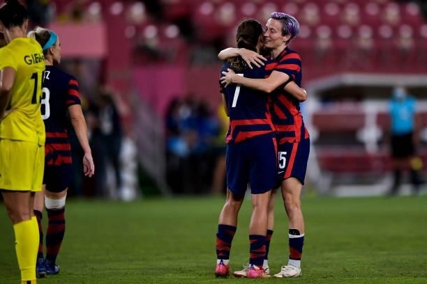 Tobin Heath of the United States and Megan Rapinoe of the United States celebrate victory during the Tokyo 2020 Olympic Womens Football Tournament...