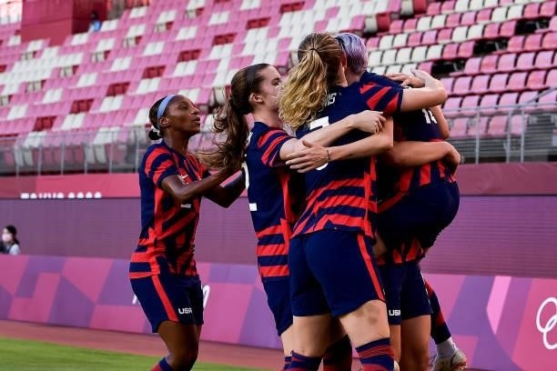 Megan Rapinoe of the United States celebrates with her team-mates after scoring her team first goal during the Tokyo 2020 Olympic Womens Football...