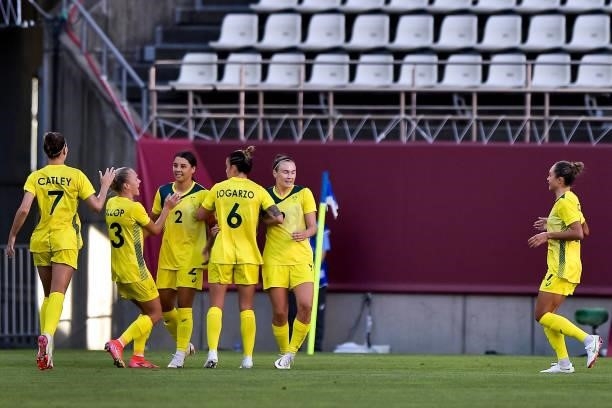 Sam Kerr of Australia celebrates with her team-mates after scoring her team first goal during the Tokyo 2020 Olympic Womens Football Tournament...