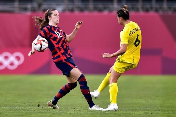 Tierna Davidson of the United States fights for the ball with Chloe Logarzo of Australia during the Tokyo 2020 Olympic Womens Football Tournament...