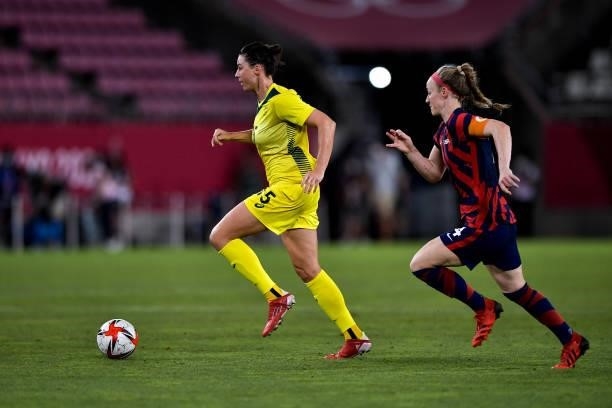 Emily Gielnik of Australia runs with the ball challenged by Becky Sauerbrunn of the United States during the Tokyo 2020 Olympic Womens Football...
