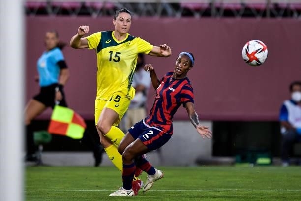 Emily Gielnik of Australia kicks to goal as Crystal Dunn of the United States trys to block during the Tokyo 2020 Olympic Womens Football Tournament...