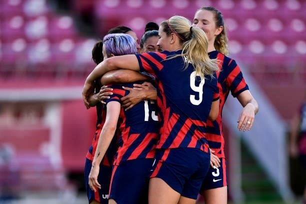 Megan Rapinoe celebrates with Carli Lloyd Christen Press and Lindsey Horan of the United States after scoring her team second goal during the Tokyo...